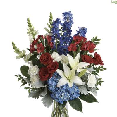 Mixed bouquet of red roses, white lilies, blue flowers, and red blooms in a glass vase