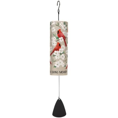 Memorial wind chime with red cardinals and white blossoms on a tall cylinder