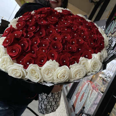 Large bouquet of red and white roses with pearl accents