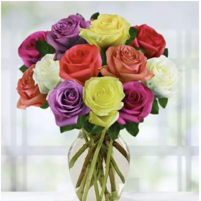 Colorful rose bouquet in a clear glass vase