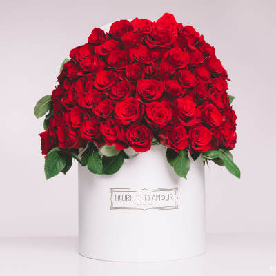 Large dome of red roses in a white hatbox