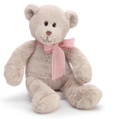 Beige plush teddy bear sitting upright with a pink ribbon bow around its neck
