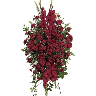 Tall red floral standing spray on an easel