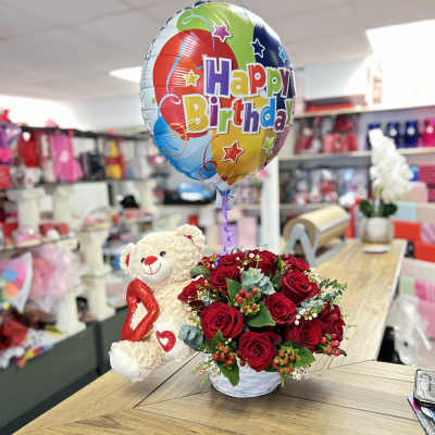 Red rose bouquet with a teddy bear and birthday balloon