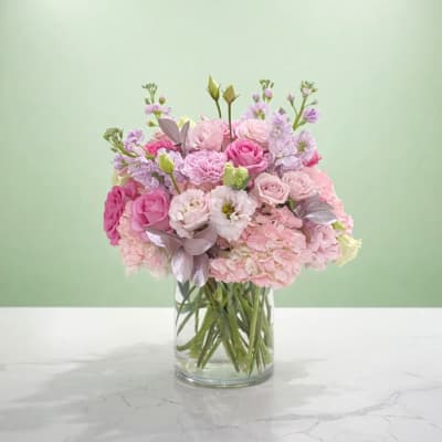 Pink and lavender bouquet in a clear glass vase
