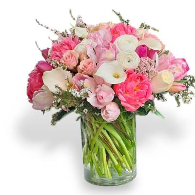 Pink and white mixed bouquet in a clear glass vase