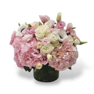 Pink and white floral arrangement in a dark vase