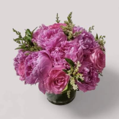 Pink rose bouquet in a small glass vase