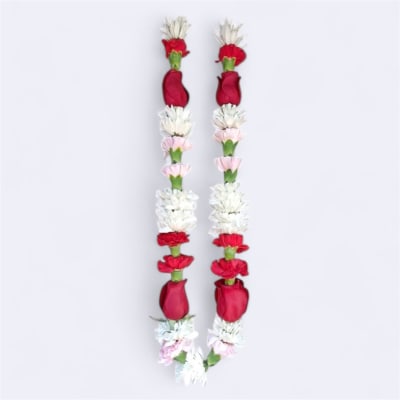 Two red and white floral garlands hanging side by side