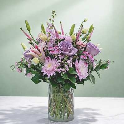 Lavender and pink bouquet in a clear glass vase