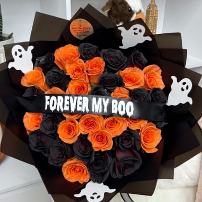 Bouquet of orange and black roses with ghost decorations and a "FOREVER MY BOO" ribbon