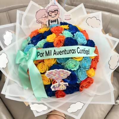 Colorful rose bouquet with a ribbon and a cartoon topper