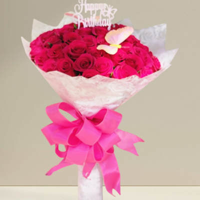 Bouquet of hot pink roses with a birthday topper and ribbon