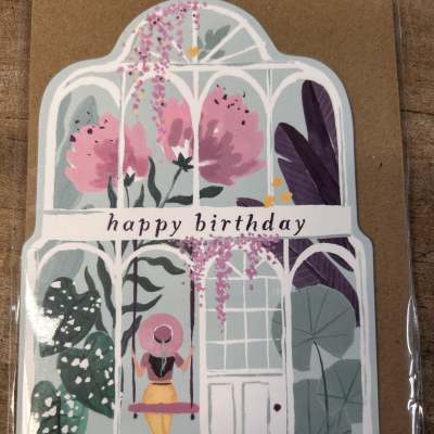 Happy birthday greeting card with greenhouse and woman on a swing illustration