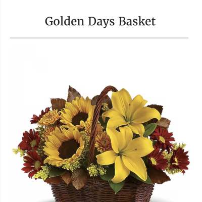 Basket of yellow lilies, sunflowers, and red daisies