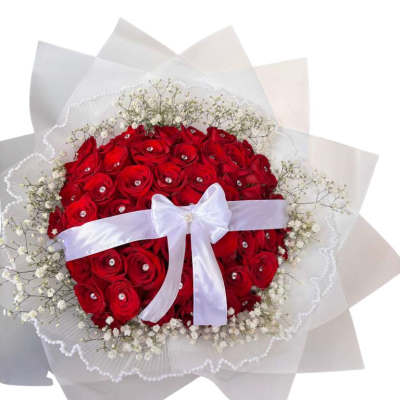 Red rose bouquet with white ribbon and baby's breath