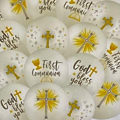 White communion balloons with gold cross designs and text