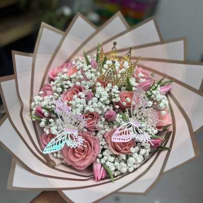 Pink rose bouquet with baby’s breath, butterflies, and gold crown picks