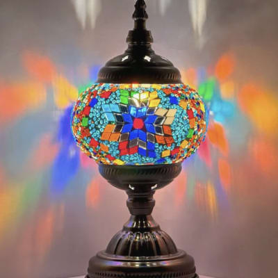 Colorful mosaic table lamp with a dark metal base