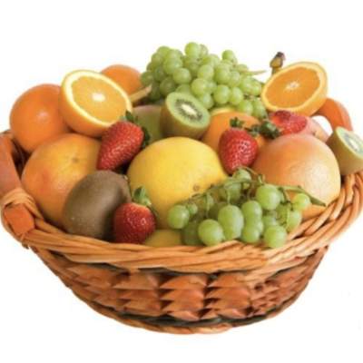 Basket of assorted fruit including oranges, grapes, strawberries, and kiwi
