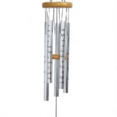 Hanging metal wind chime with a wooden top and prayer plaque
