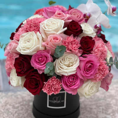 Roses, carnations, orchid and eucalyptus.