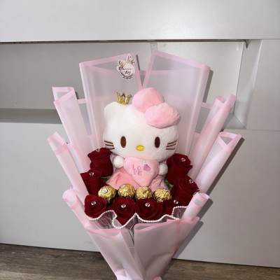 Bouquet of red roses with a Hello Kitty plush and gold chocolates in pink wrap
