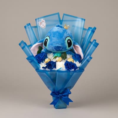 Blue plush character bouquet with white and blue flowers