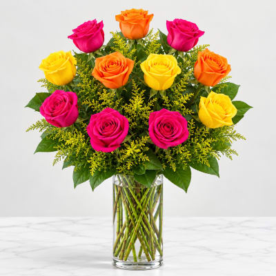 Bouquet of pink, orange, and yellow roses in a clear glass vase