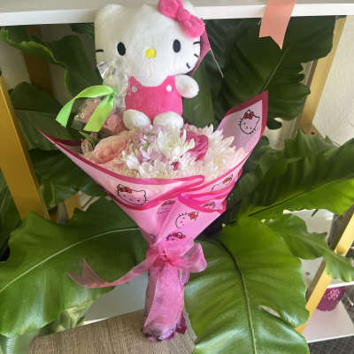 Pink bouquet with a Hello Kitty plush and ribbon wrap