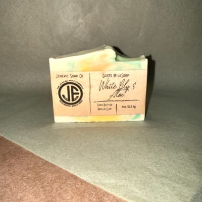 Bar of handmade soap in a paper label wrapper