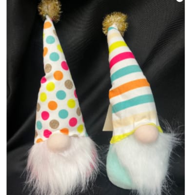 Two small gnome figurines with tall patterned hats and fluffy beards