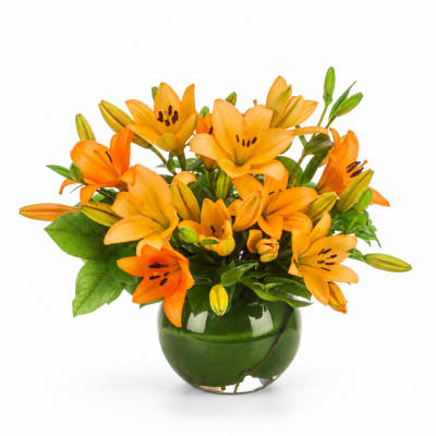 Orange lilies arranged in a green glass vase