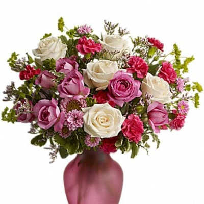 Pink and white rose bouquet in a pink vase