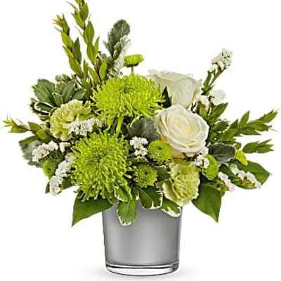 White roses and green chrysanthemums in a glass vase
