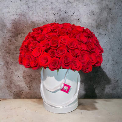 Large bouquet of red roses in a white hat box