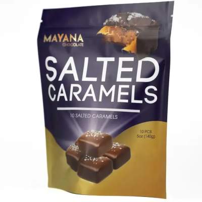 Bag of salted caramels in dark purple and gold packaging