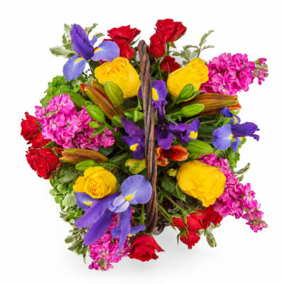 Basket of mixed roses, irises, and pink blooms