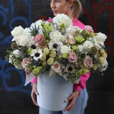 Large bouquet of white and blush flowers in a white hat box