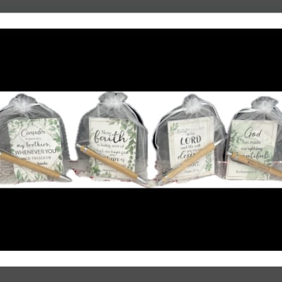 Four gift bags with inspirational cards and wooden pencils