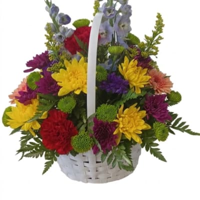 Colorful mixed flower basket with a white handle