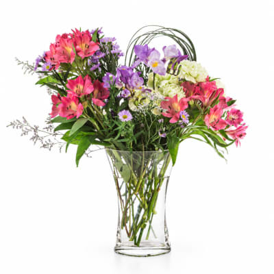 Colorful mixed bouquet in a clear glass vase