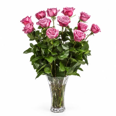 Pink roses arranged in a clear glass vase