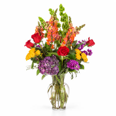 Colorful mixed bouquet in a clear glass vase