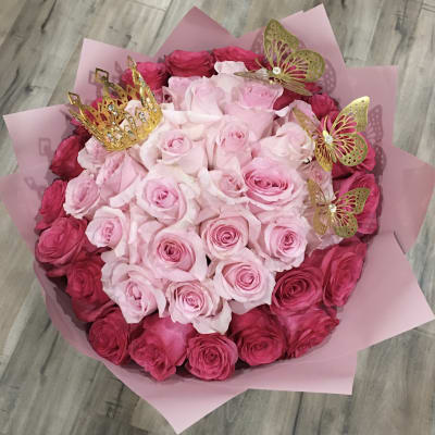 Pink and red rose bouquet with gold crown and butterfly picks