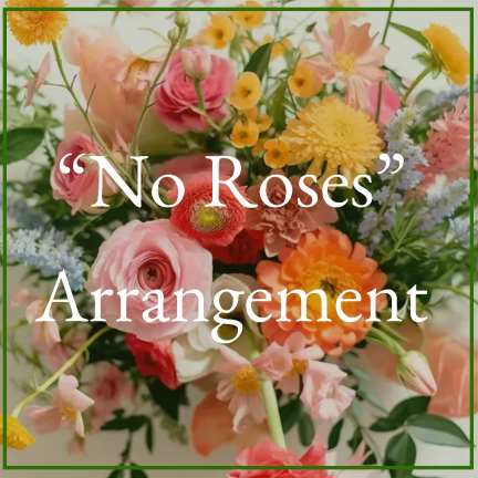 Colorful arrangement of mixed pink, orange, and yellow flowers with soft blue accents.