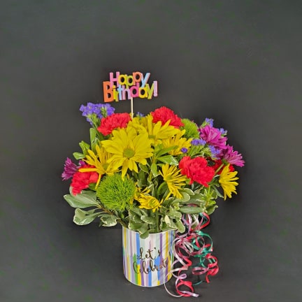 Colorful mixed bouquet in a striped pot with a Happy Birthday topper