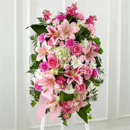 Pink and white floral standing spray with lilies and roses