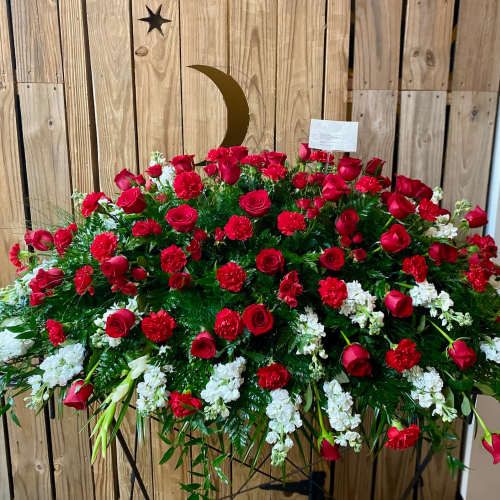 Large red and white floral spray with roses and carnations