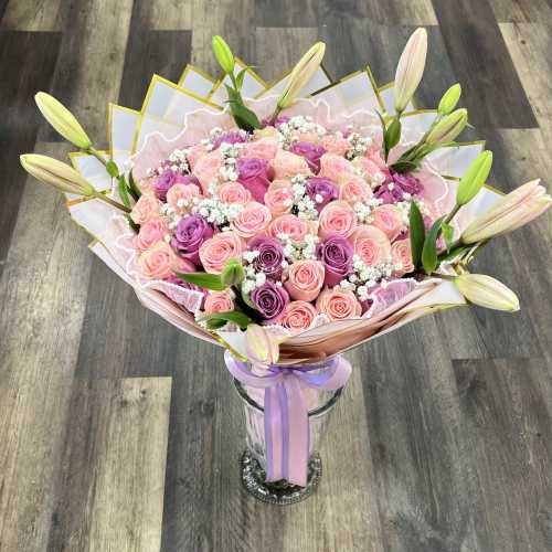 50 Pink And Purple Roses Bouquet With Baby’s Breath Between The Roses And Lillies